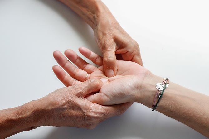 patient receiving a hand massage